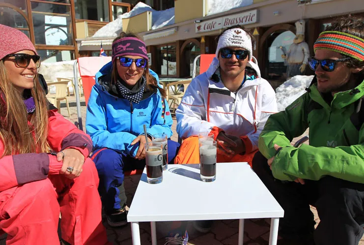 pals enjoy an apres drink in the sun